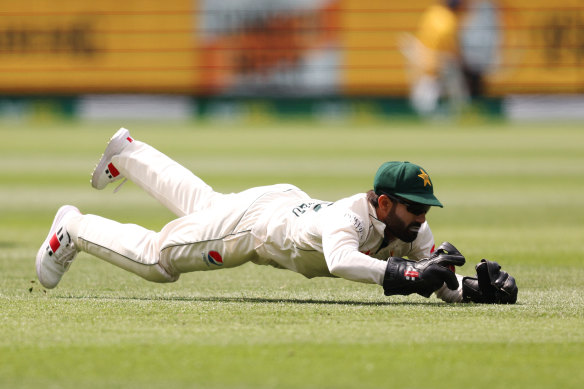 Mohammad Rizwan holds the catch.