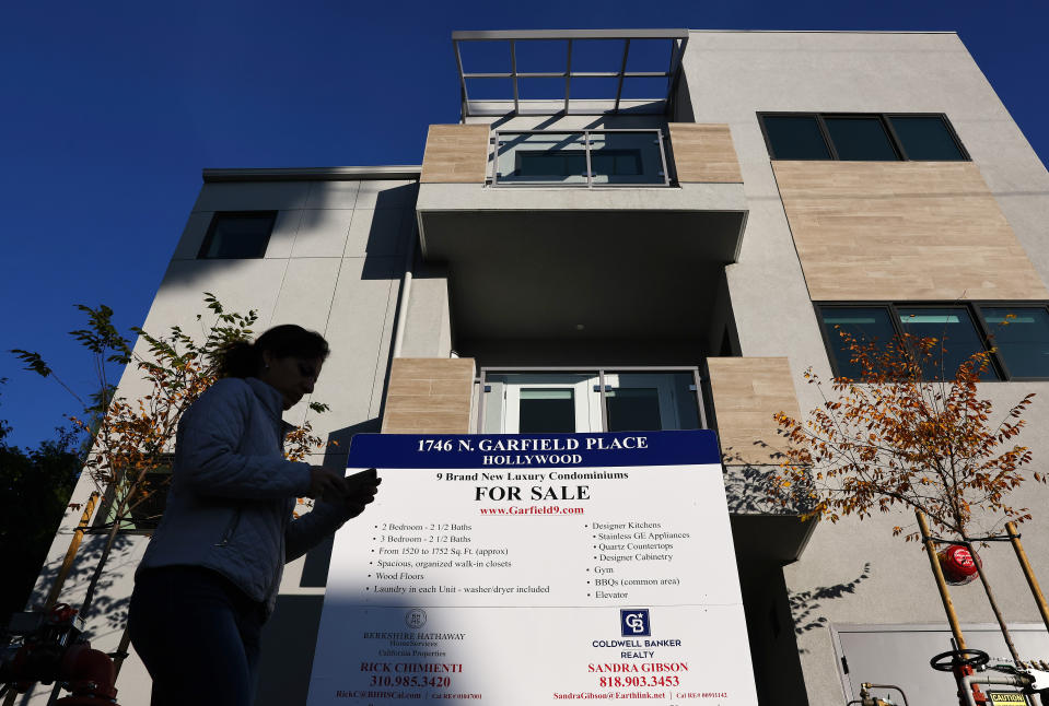 A sign is posted in front of new condominiums for sale in Los Angeles, California. (Credit: Mario Tama, Getty Images)