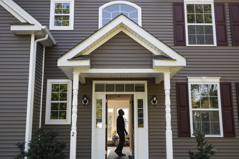 A homeowner tours their new home, in Washingtonville, N.Y. (Credit: John Minchillo, AP Photo)