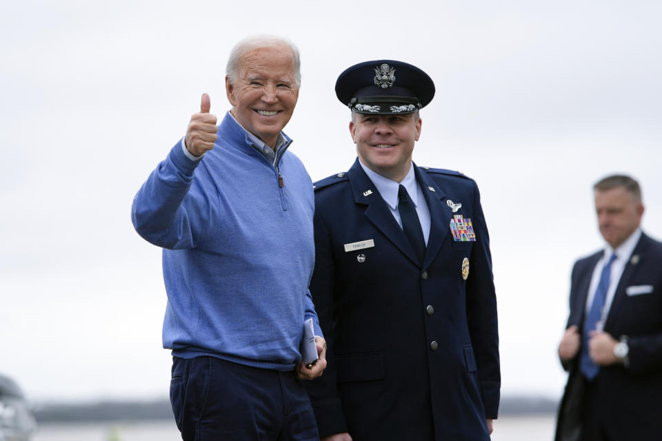 President Joe Biden stands with Col. Paul Pawluk, Vice Commander for the 89th Airlift Wing, before he boards Air Force One upon departure, Thursday, Jan. 25, 2024, at Andrews Air Force Base, Md. Biden is headed to Wisconsin. (AP Photo/Alex Brandon)
