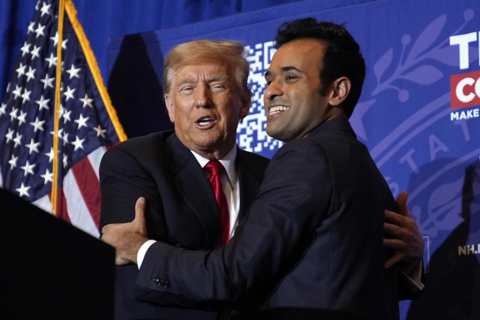Republican presidential candidate former President Donald Trump embraces former candidate Vivek Ramaswamy at a campaign event in Atkinson, N.H., Tuesday, Jan. 16, 2024. (AP Photo/Matt Rourke)