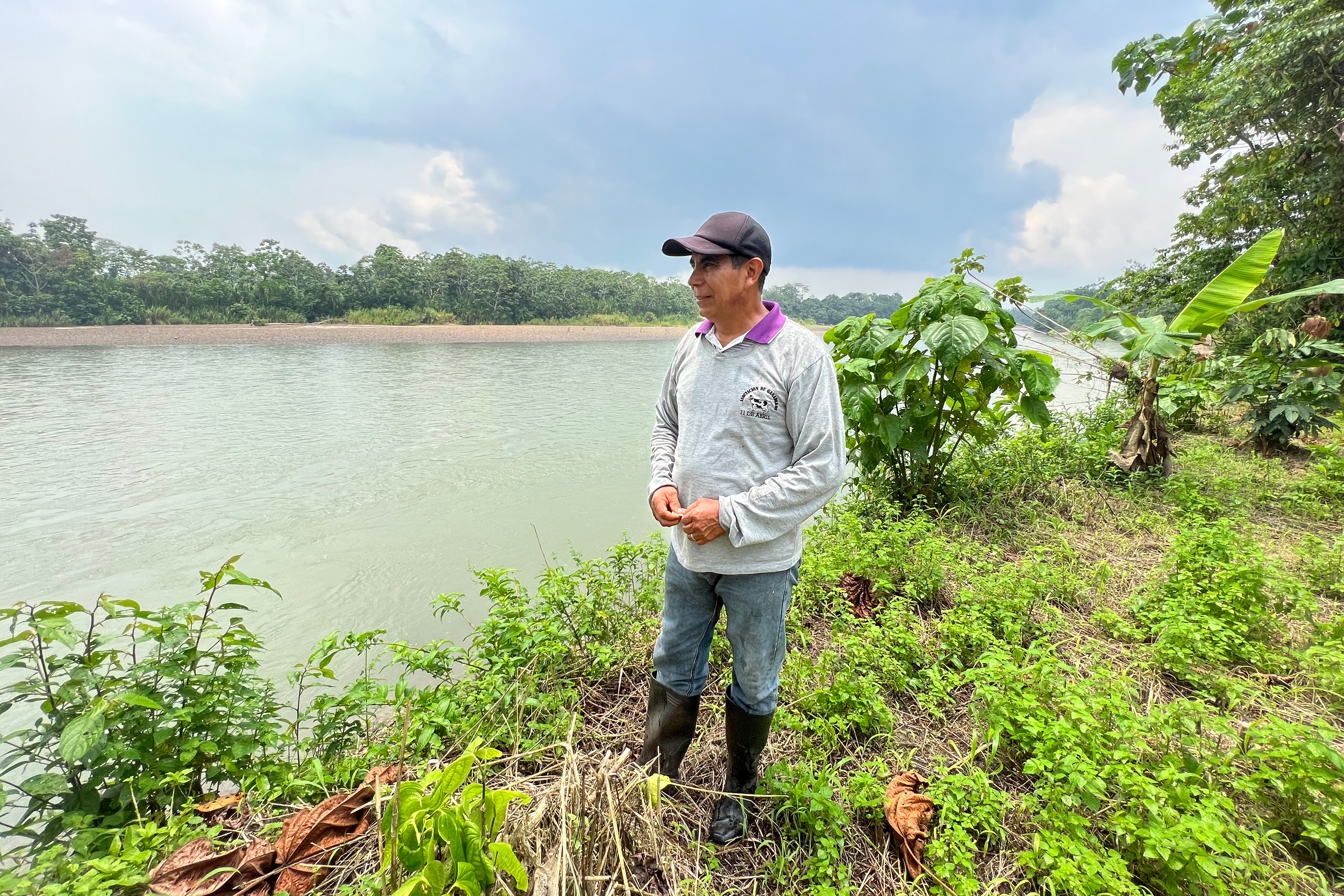 Celso Mora stands on his property adjacent to the Napo River on March 21, 2023. Mora, who is now in his early 60s, and his wife, Nancy, migrated to the Ecuadorian Amazon region with hopes of operating their own farm and raising a family. Credit: Katie Surma/Inside Climate News