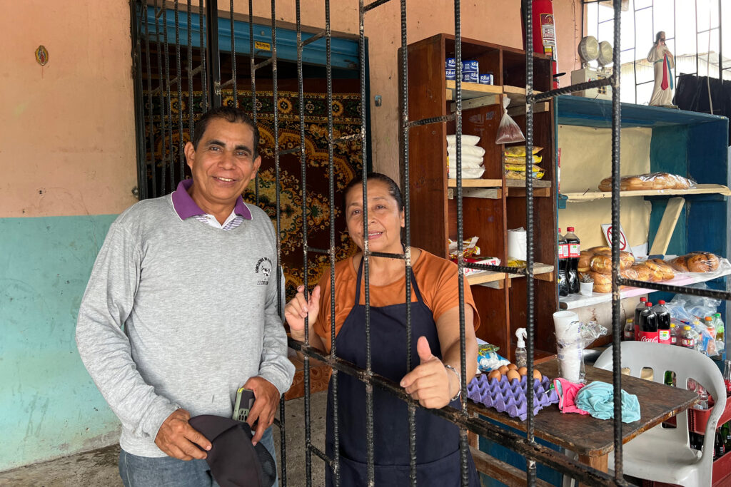 Celso and Nancy Mora stand on the veranda of their bakery in the town of La Belleza, Ecuador. The Mora's relocated to the town to escape air, water and other pollution from nearby oil operations. Credit: Katie Surma/Inside Climate News