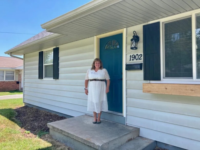 Abigail Cook, executive director of the Women's Medical Respite, stands in front of the recently-purchased home that will increase the program's capacity from three beds to eight beds.