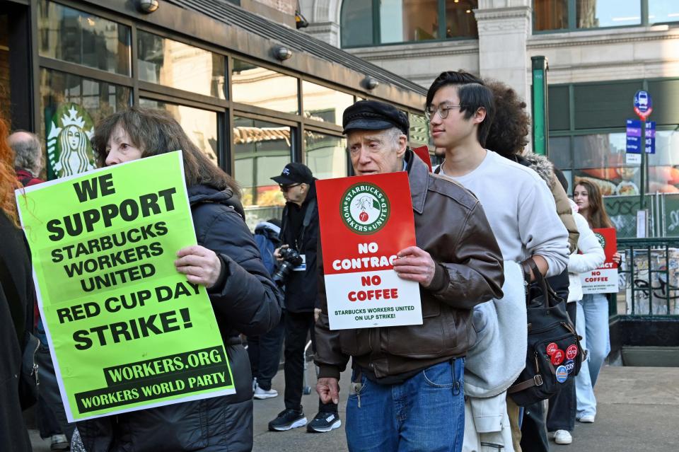 Starbucks workers are striking due to overwhelming demands and understaffing at many of the stores in New York, USA, on November 16, 2023. They are exerting pressure to improve working conditions, especially during promotions like Red Cup Day, and are seeking contracts that stipulate conditions such as pay, benefits, and staffing levels. (Photo by Victor M. Matos/Thenews2/NurPhoto via Getty Images)