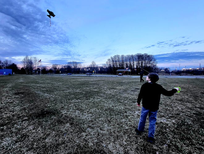 Nine-year-old Wyatt Smith Flies a kite on Thursday, Feb. 8, 2024, at Port Huron Township's Bakers Field Park, where the township is slated to a put a mile-long walking path later this year with a boost from county-administered American Rescue Plan Act funds. When asked what else they'd like to see at the park, Wyatt said he'd like to see a playground or, if not for occasional floods, minigolf.