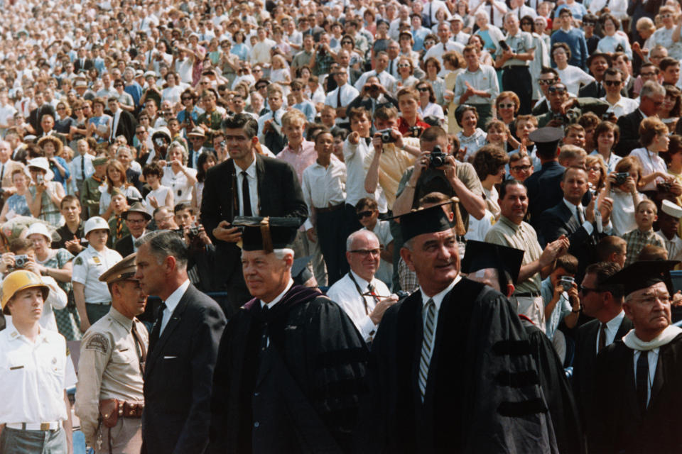 President Lyndon B. Johnson promotes his Great Society vision through the commencement address delivered to graduates of the University of Michigan. (Photo by © CORBIS/Corbis via Getty Images)