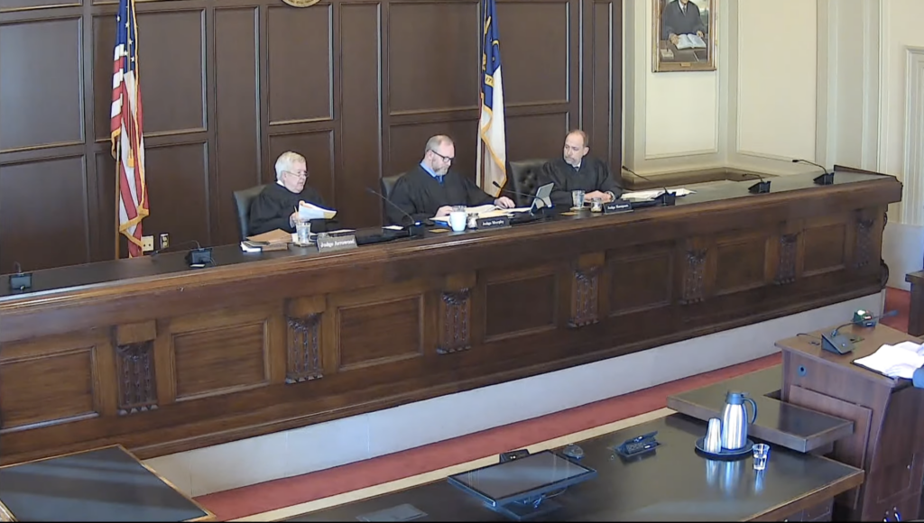 three Court of Appeals judges listen to arguments