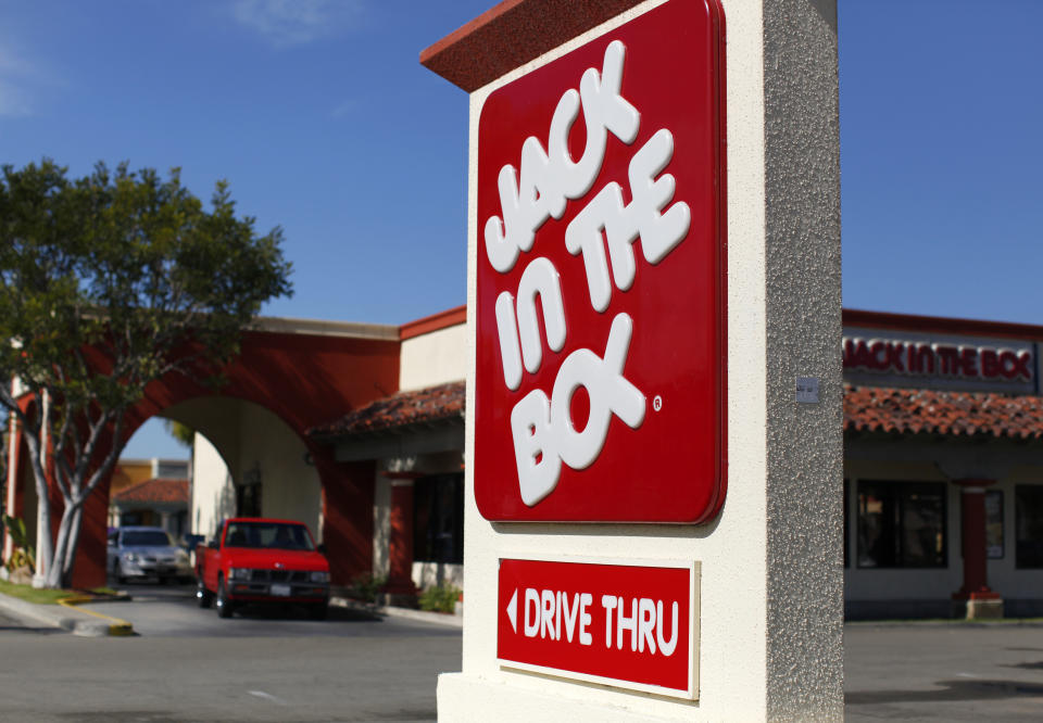A Jack in The Box drive thru restaurant is pictured in San Marcos, California February 21, 2012. Jack in the Box will report earnings this week. REUTERS/Mike Blake  (UNITED STATES - Tags: BUSINESS FOOD)
