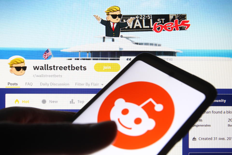 UKRAINE - 2021/02/08: In this photo illustration a Reddit logo is seen on a mobile phone screen in front of WallStreetBets (WSB) logo of a subreddit where participants discuss stock and options trading. (Photo Illustration by Pavlo Gonchar/SOPA Images/LightRocket via Getty Images)