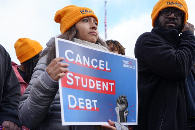 Protesters gather outside the Supreme Court on Feb. 28, 2023, ahead of the oral arguments in cases that challenge President Joe Biden's $400 billion student loan forgiveness plan. That June, a majority of justices ruled on ideological lines that the Biden administration overstepped its power.