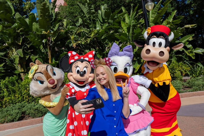 Spice Girls' Emma Bunton takes a selfie with characters at Disney World.