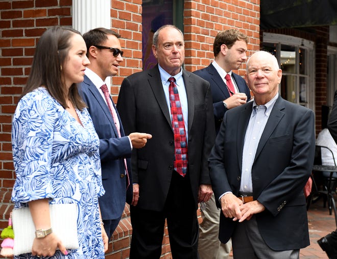 In this file photo, Berlin Mayor Zackery Tyndall (with sunglasses), Stephen Umberger, district director of U.S. Small Business Administration, at center, and U.S. Senator Ben Cardin, right, during a walking tour to small businesses Thursday, Aug. 18, 2023, in Berlin, Maryland.