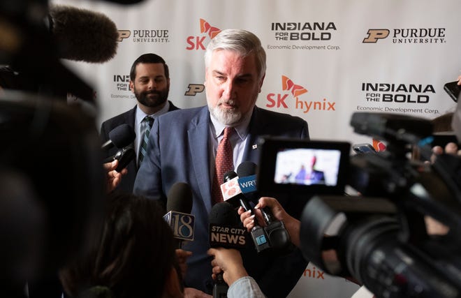 Governor of Indiana Eric Holcomb answers questions from the media during the announcement of the partnership between Purdue University and SK hynix, Wednesday, April 3, 2024, at Purdue Memorial Union in West Lafayette, Ind.