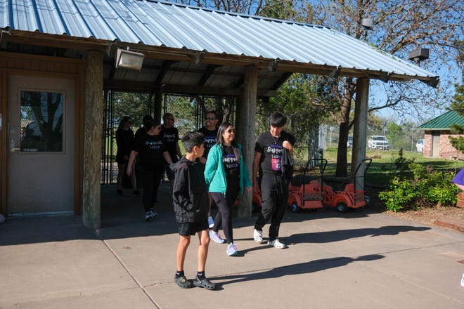 Walkers enter the Amarillo Zoo following the Annual Epilepsy Foundation Walk Saturday at Thompson Park in Amarillo.