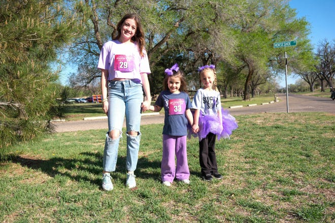 A family joins the walk at the Annual Epilepsy Foundation Walk Saturday at Thompson Park in Amarillo.
