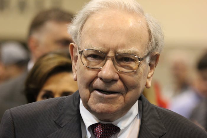 Close-up shot of Warren Buffett at an event looking toward the camera.