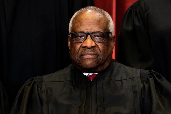 Justice Clarence Thomas poses during a group photo of the justices at the Supreme Court in Washington, U.S., April 23, 2021.