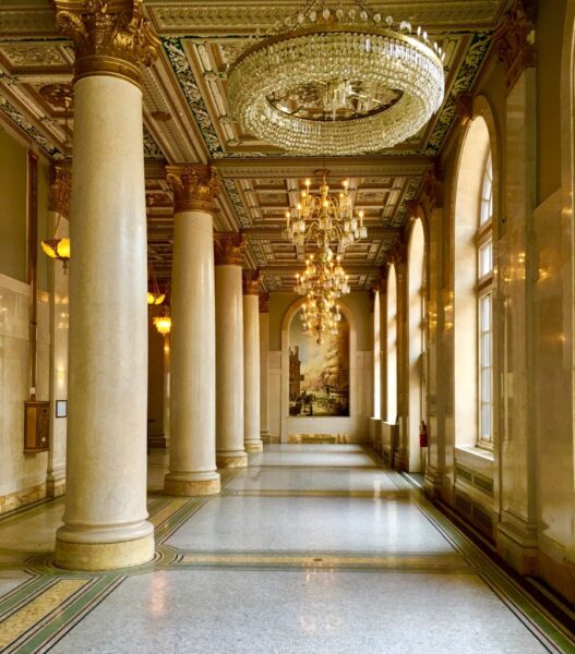These majestic columns and chandeliers are part of the Bossert Hotel’s glory. 