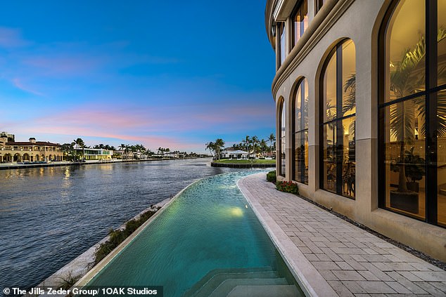 The infinity pool in the Boca Raton waterfront mansion is seen at night