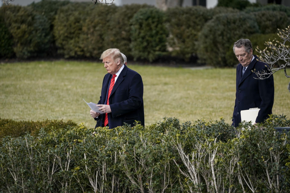 WASHINGTON, DC - JANUARY 29: (L-R) U.S. President Donald Trump, Vice President Mike Pence and United States Trade Representative Robert Lighthizer arrive for a signing ceremony for the United States-Mexico-Canada Trade Agreement on the South Lawn of the White House on January 29, 2020 in Washington, DC. The new U.S.-Mexico-Canada Agreement (USMCA) will replace the 25-year-old North American Free Trade Agreement (NAFTA) with provisions aimed at strengthening the U.S. auto manufacturing industry, improving labor standards enforcement and increasing market access for American dairy farmers.  The USMCA signing is considered one of President Trump's biggest legislative achievements since Democrats took control of the House in 2018. (Photo by Drew Angerer/Getty Images)
