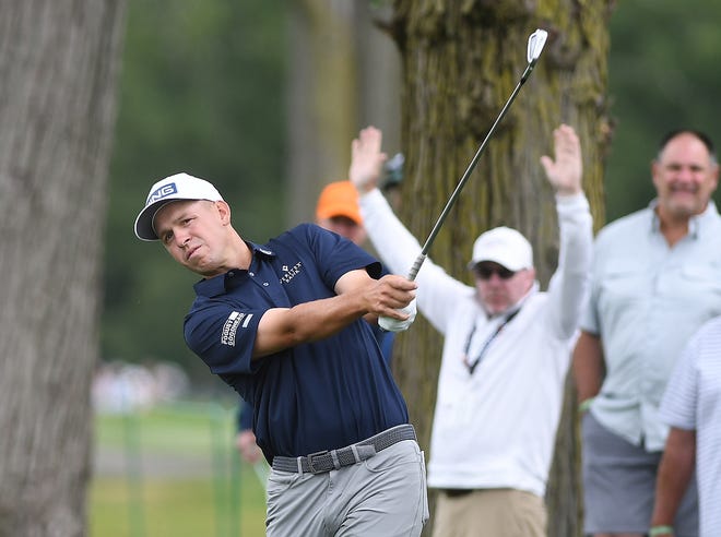 Sam Stevens hits out of the rough on the second hole during the second round of the Rocket Mortgage Classic.
