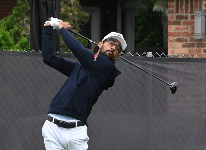 Akshay Bhatia tees off at the eighth hole during the second round of the Rocket Mortgage Classic.
