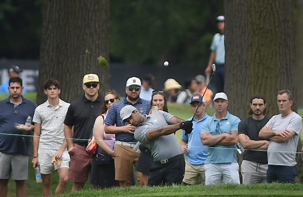Aaron Rai hits from the rough during the second round of the Rocket Mortgage Classic.