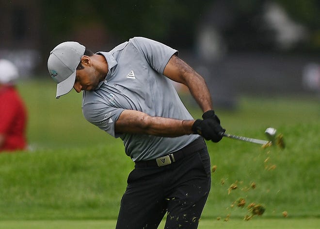 Aaron Rai hits from the 18th fairway during the second round of the Rocket Mortgage Classic.