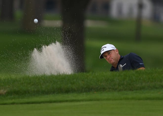 Alex Noren takes one out of the sand trap on 18th hole during the second round of the Rocket Mortgage Classic.