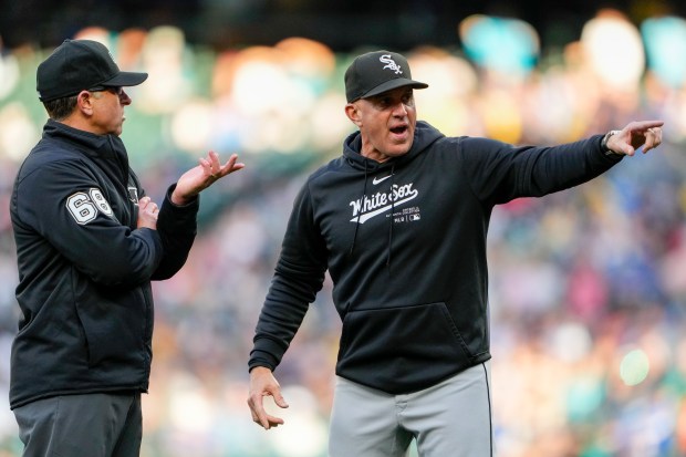 White Sox manager Pedro Grifol, argues with second base umpire Chris Guccione after Paul DeJong was caught stealing second against the Mariners during the fourth inning on June 12, 2024, in Seattle. (AP Photo/Lindsey Wasson)