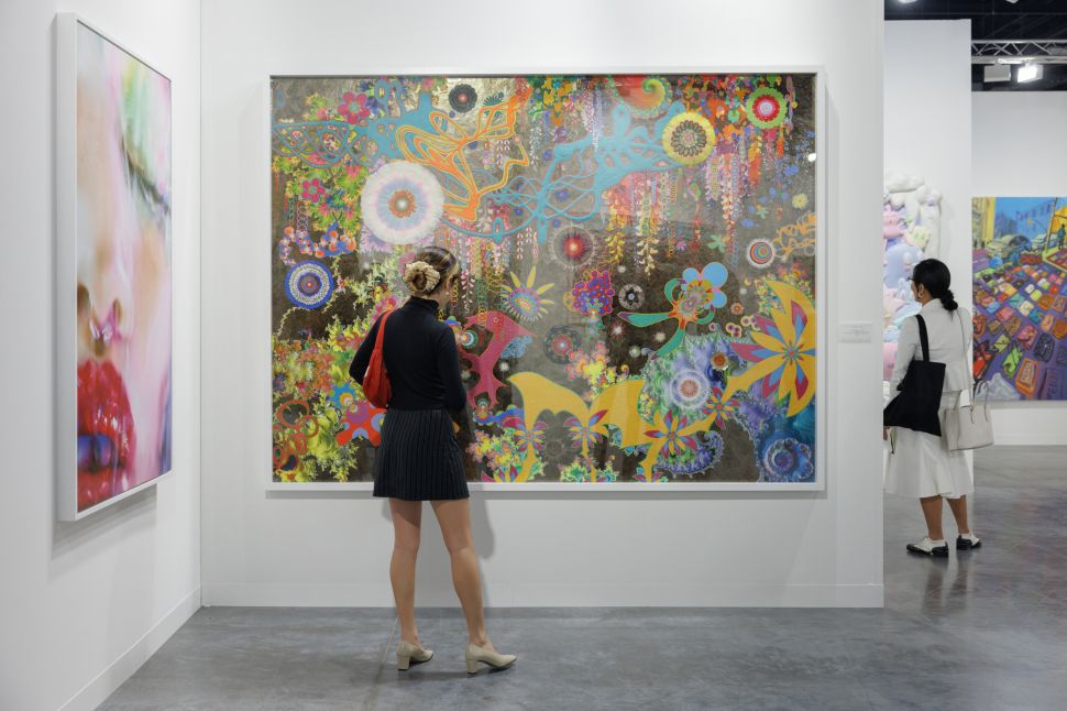 Young Collector in front of a painting at Art Basel 