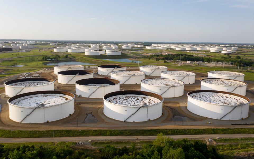 An aerial view of a crude oil storage facility is seen on May 4, 2020 in Cushing, Oklahoma. - Using his fleet of drones, Dale Parrish tracks one of the most sensitive data points in the oil world: the amount of crude stored in giant steel tanks in Cushing, Oklahoma. The West Texas Intermediate oil stored in the small town in the midwestern United States is used as a reference price for crude bought and sold by refiners in Asia, hedge funds in London and traders in New York. (Photo by Johannes EISELE / AFP) (Photo by JOHANNES EISELE/AFP via Getty Images)