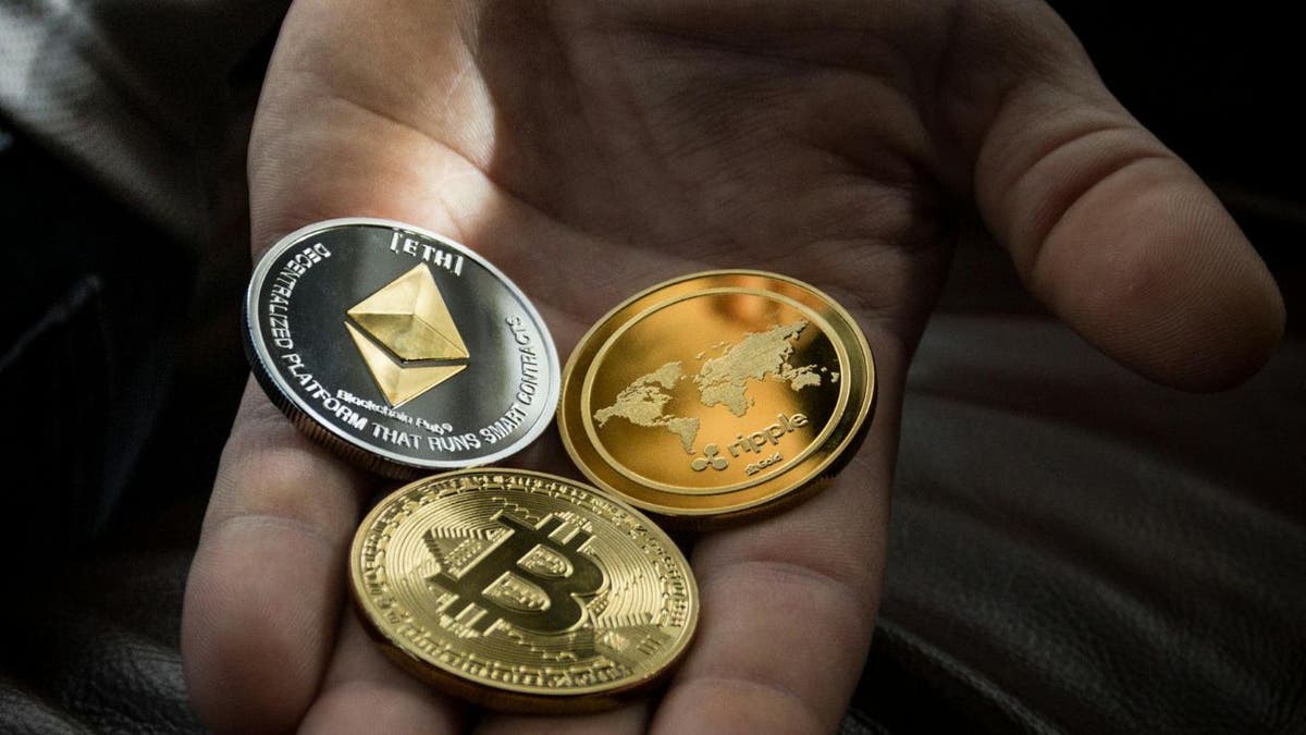 Crypto coins in hand