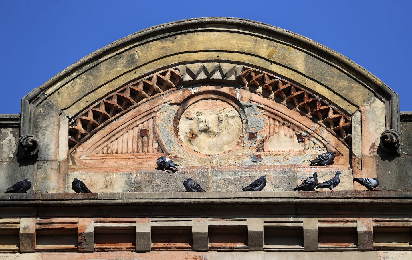 Faded architectural details of the building's exterior.