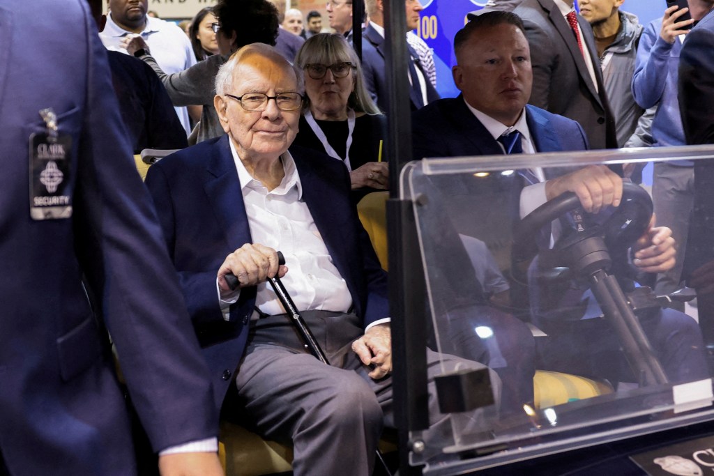Warren Buffett attending the Berkshire Hathaway annual shareholders' meeting in Omaha, Nebraska on May 3, 2024, with Susan Alice Buffett, Zhou Xiaolan, Jon Ledecky, and Paweł Łukaszewski present.