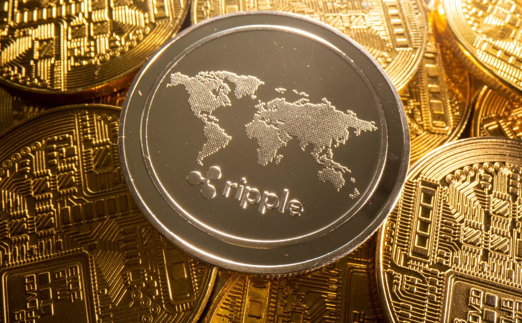 A coin representing the cryptocurrency Ripple with a world map design