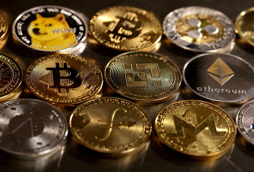 An illustration showing a group of various cryptocurrency symbols.