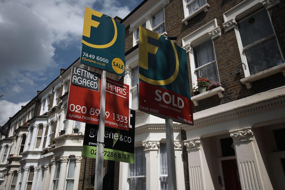 For sale and sold signs outside London houses.