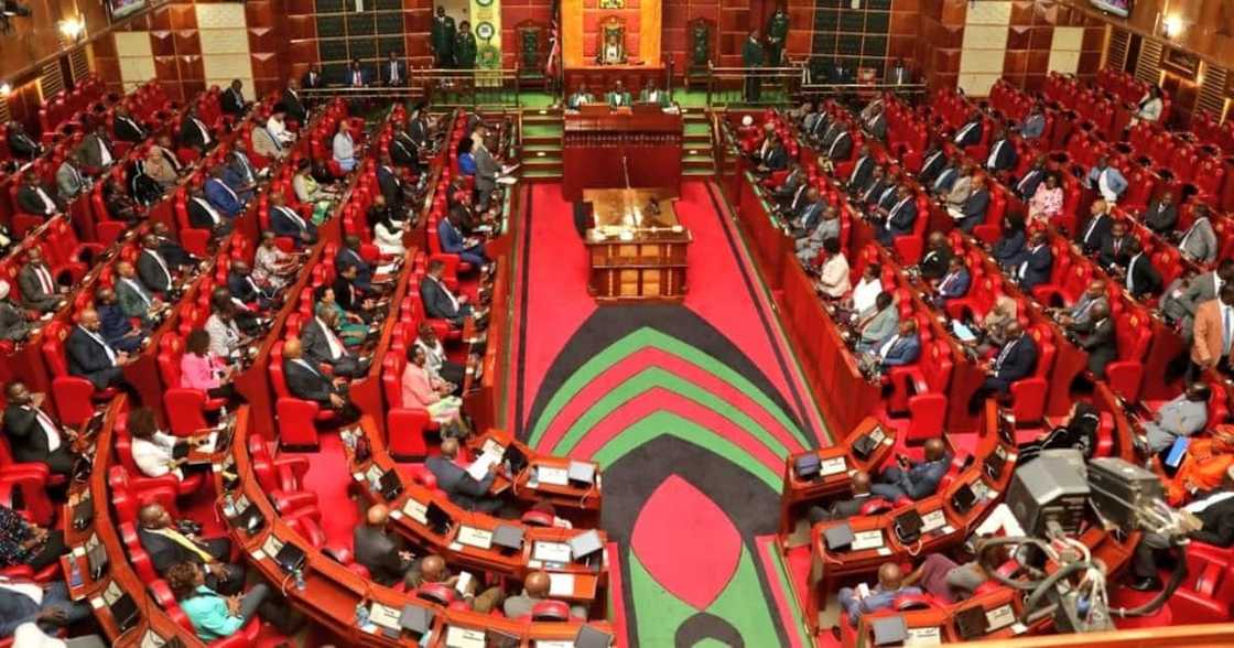 MPs at a past session. MPs at a past session.