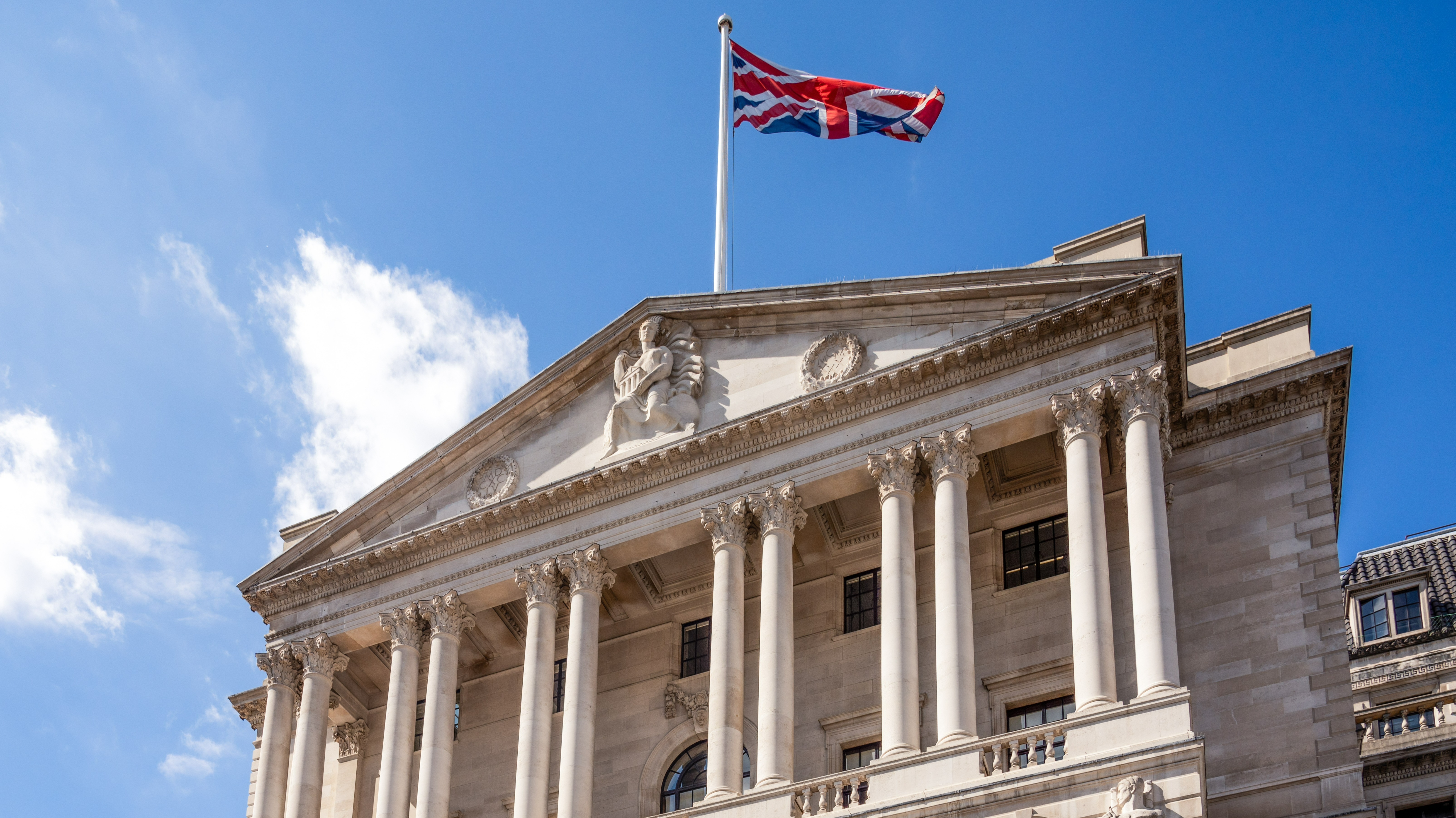 The Bank of England with a Union Jack flag flying above it.