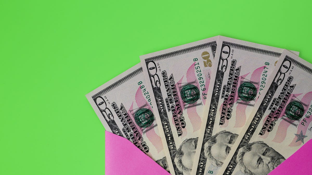 $50 cash bills on envelope