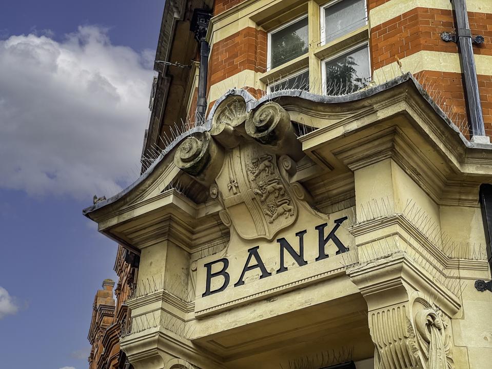Generic High Street Banks Sign. Banks stopping account holders buying using or processing crypto related transactions as traditional banking industry declares war on crypto currencies