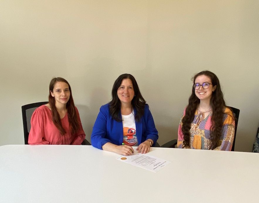 Jenn Burston and Kaylee Hannah with Mayor Sharilyn Knox as she proclaimed this Sunday as Elder Abuse Awareness Day