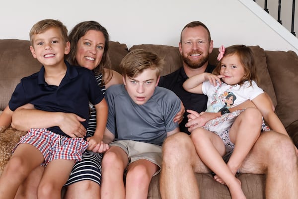 The Ely family poses for a portrait at their home in Canton on Friday, May 30, 2025. At 17-months-old, Stetson was diagnosed with Angelman syndrome, a rare neurogenetic disorder. (Natrice Miller/ AJC)