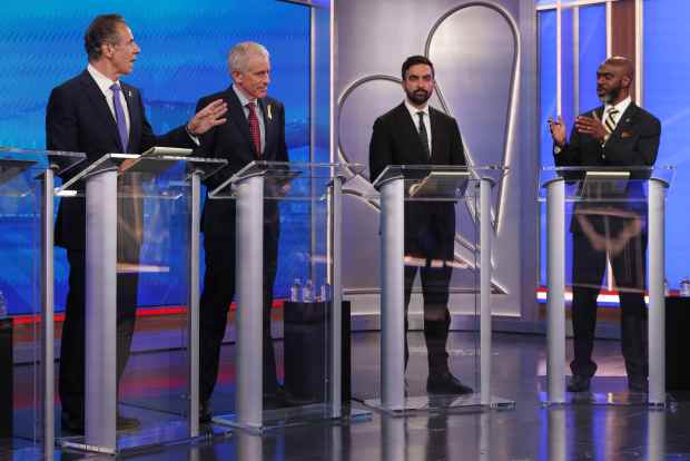 Democratic mayoral candidates Andrew Cuomo, far left, and Michael Blake present arguments as Whitney Tilson, second from left, and Zohran Mamdani look on during in the New York City Democratic Mayoral Primary Debate at NBC Studios on June 4, 2025 in New York City. (Photo by Yuki Iwamura-Pool/Getty Images)