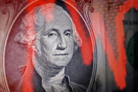Illustration shows U.S. dollar banknote and stock graph