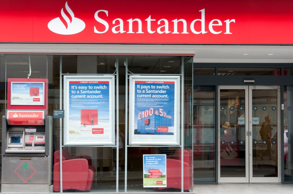 Santander bank branch exterior with ATM and signage advertising current accounts.