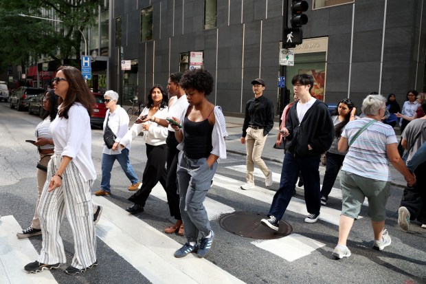 Through Chicago Cancer Health Equity Collaborative Fellows program at the Northwestern University, undergraduates and recent graduates who are interested in medical school walk toward for a tour at a Northwestern surgical bio skills simulation lab on July 21, 2025. (Antonio Perez/Chicago Tribune)