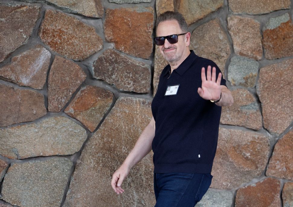 Man in black shirt walks outside